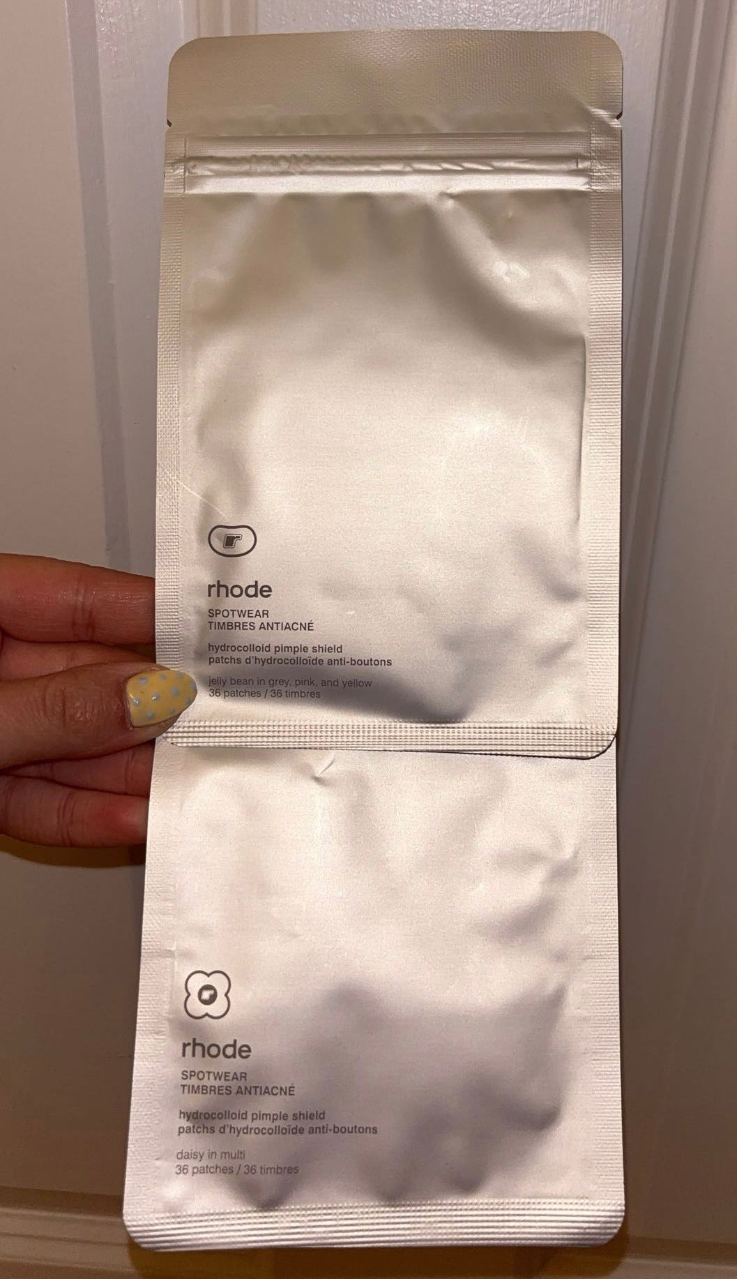 Packaging for Rhode Spotwear Hydrocolloid Pimple Patches in Jelly Bean and Daisy designs, labeled as hydrocolloid pimple shields.