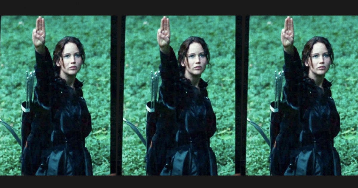 Hunger Games : la scène culte où le salut de Katniss devient symbole de  rébellion - Marie Claire