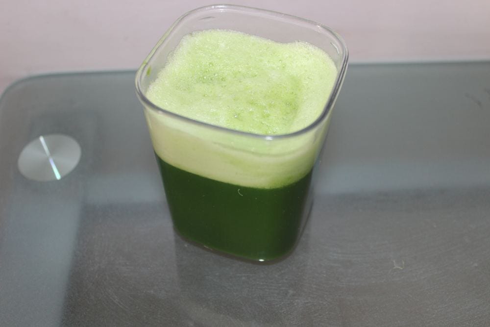 A glass of fresh wheatgrass juice A glass of fresh wheatgrass juice