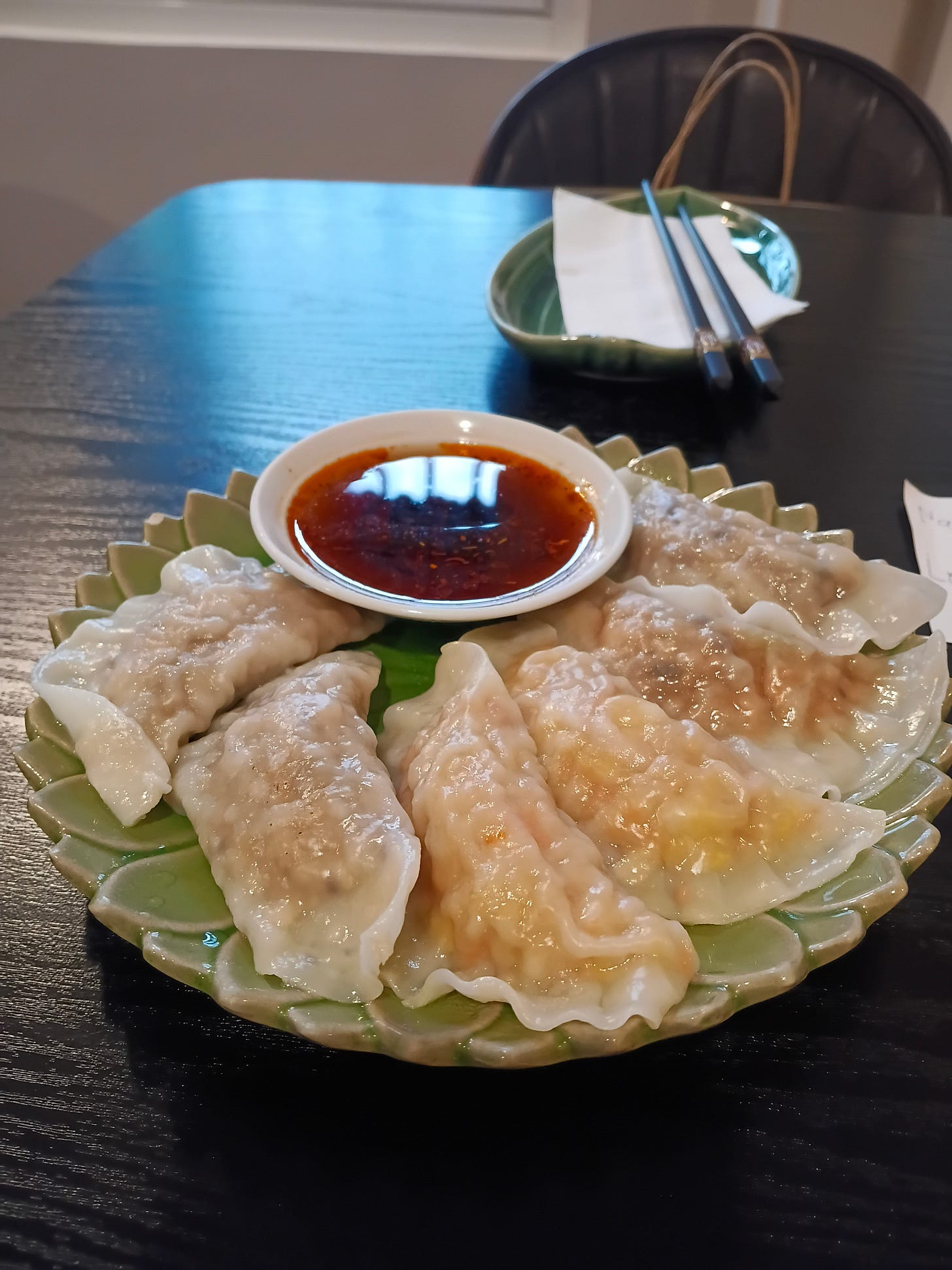 boiled dumplings + dip on a plate boiled dumplings + dip on a plate