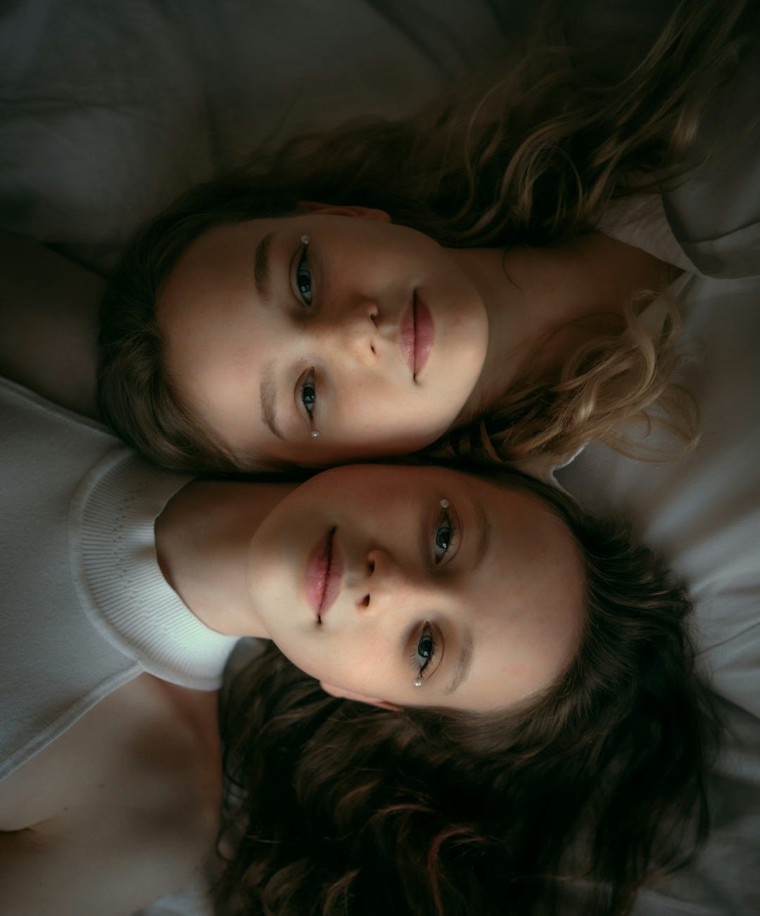 a woman lying on a bed