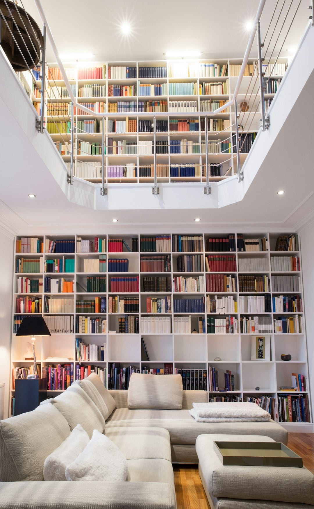 white wooden book shelves with books white wooden book shelves with books