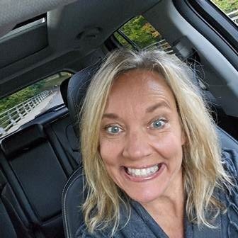 A person smiling in a car

AI-generated content may be incorrect.