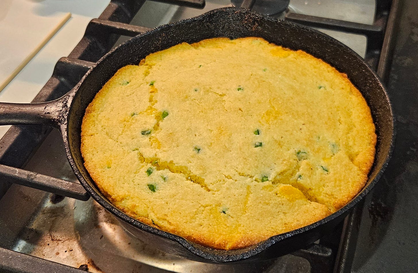 fully baked corn bread in a cast iron pan
