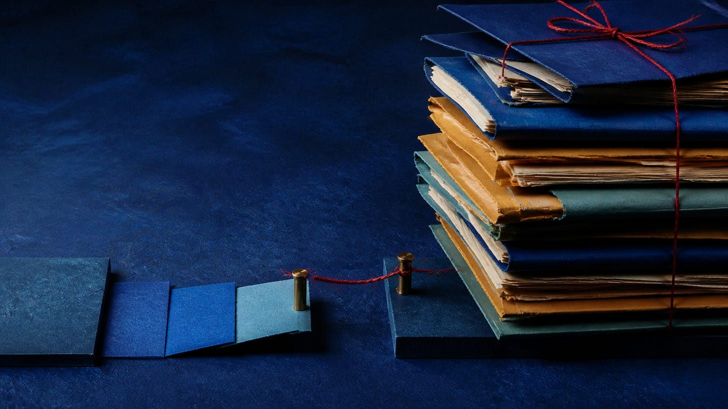 A stack of blue, ochre and green folders stops beside an incomplete paper route, with red thread unable to bridge the gap.