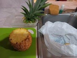 A pineapple on a cutting board next to a pineapple

AI-generated content may be incorrect.