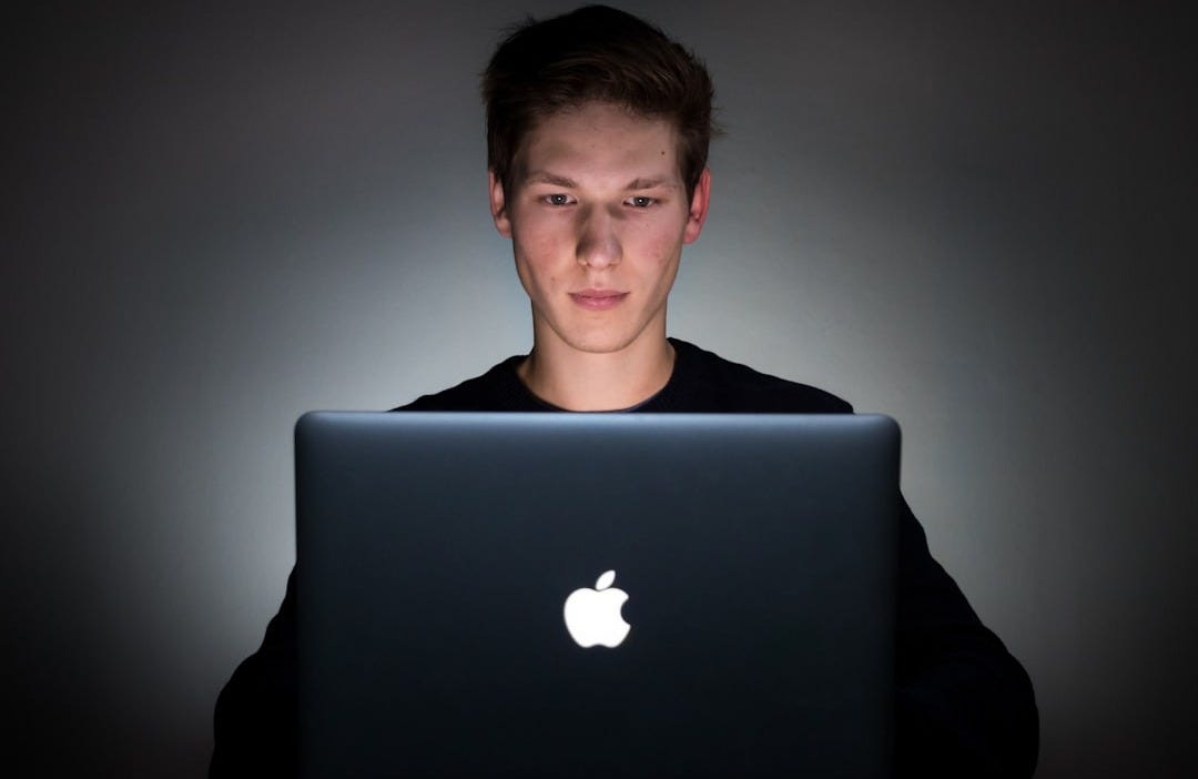 man using laptop