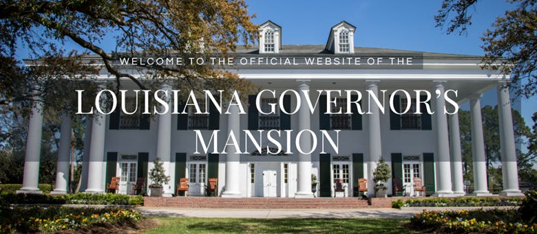 A large white building with columns

AI-generated content may be incorrect.