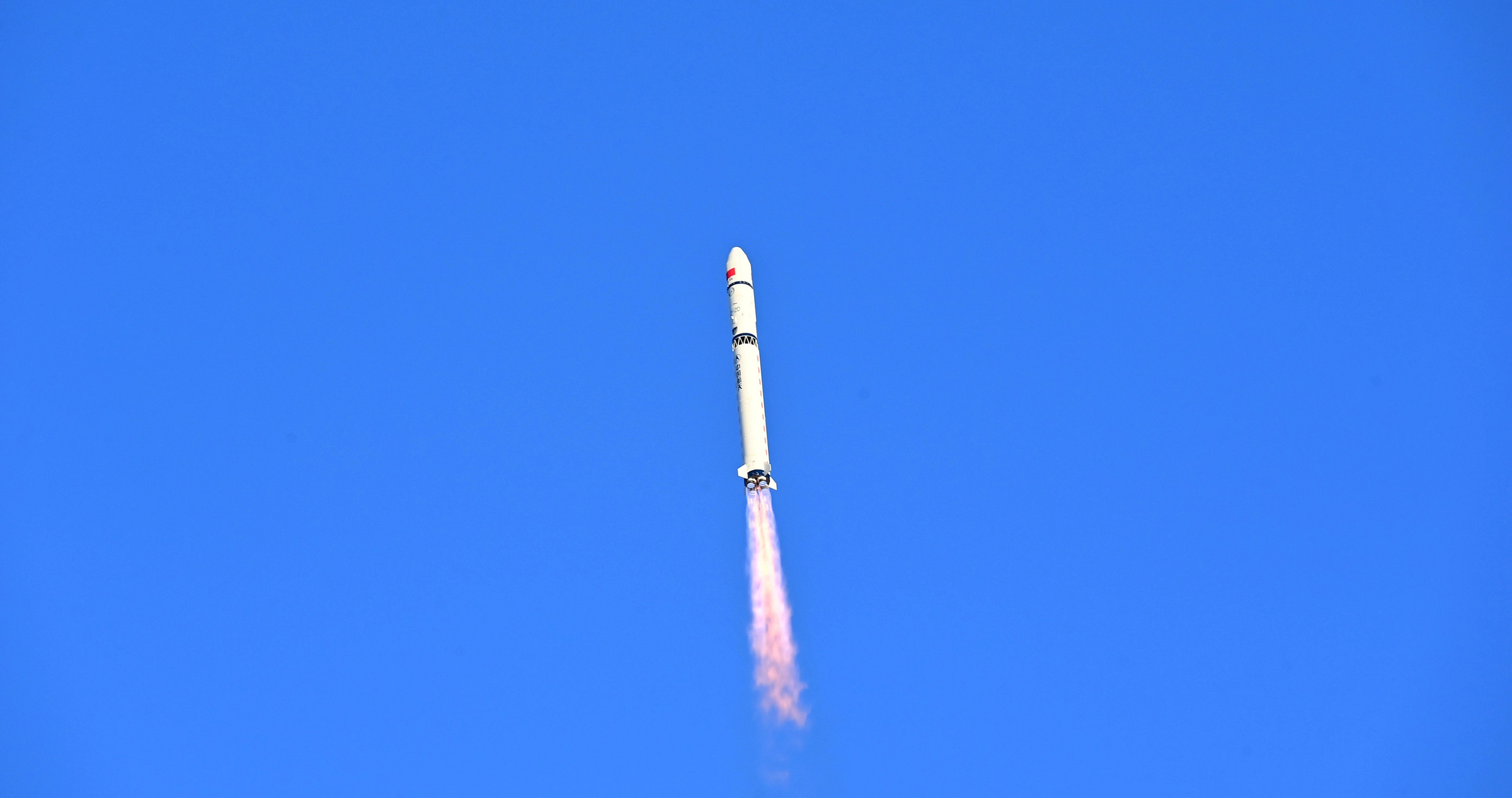 The Long March 2D vehicle during first-stage flight.