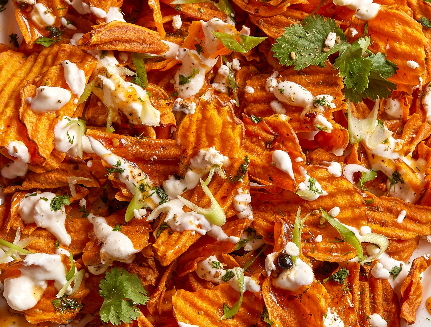Sweet potato chip salad with yogurt drizzle.