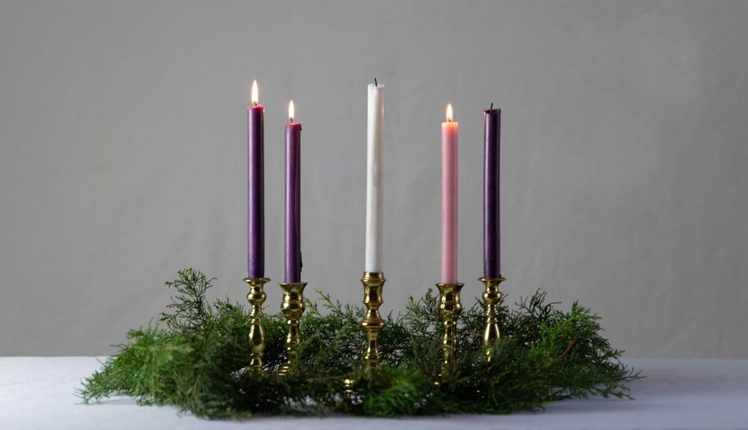 pink candles on gold candle holder