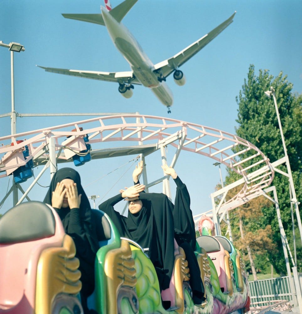 A low-flying plane above students at a funfair. From the series ‘Hafiz: The Guardians of Quran’. Istanbul, Turkey, 2018. A low-flying plane above students at a funfair. From the series ‘Hafiz: The Guardians of Quran’. Istanbul, Turkey, 2018.