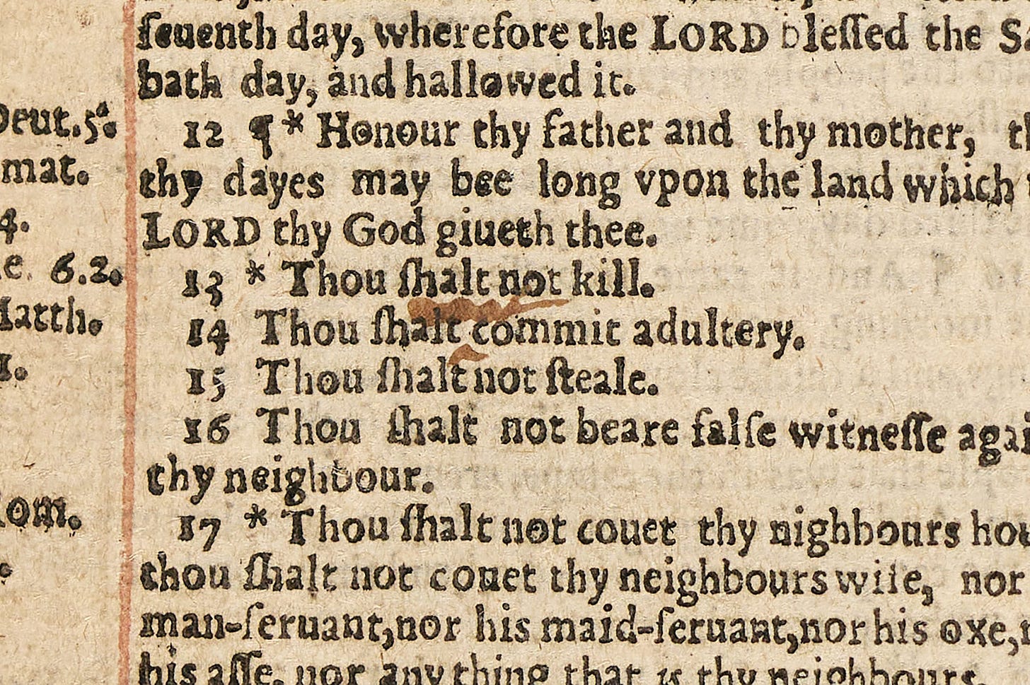 Close-up Bible page showing misprint “Thou shalt commit adultery” in Ten Commandments passage. Close-up Bible page showing misprint “Thou shalt commit adultery” in Ten Commandments passage.