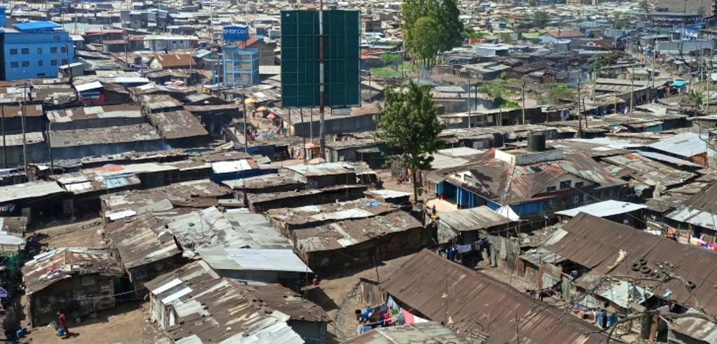 An aerial photograph of slums with a few modern building elements An aerial photograph of slums with a few modern building elements