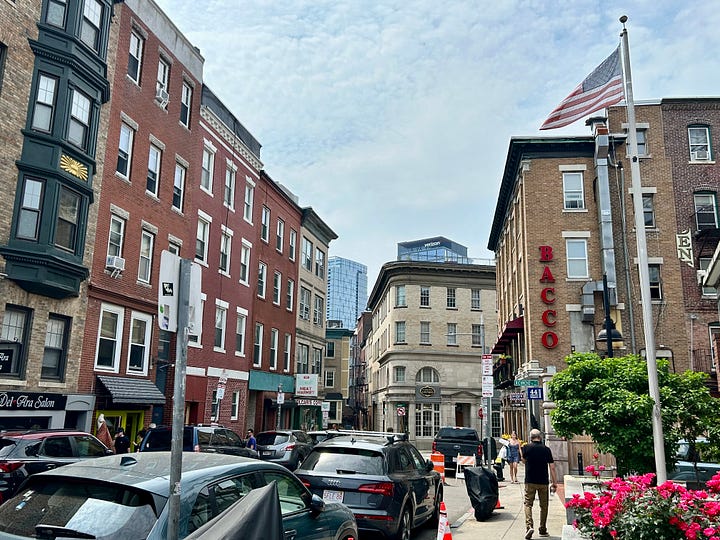 buildings, streets, signs, people