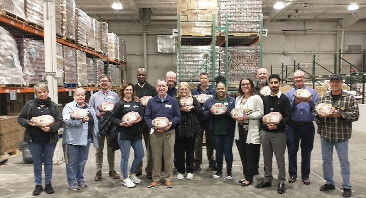 Giant Food's local management and human resources team visited the Fredericksburg Regional Food Bank last week to donate 200 Easter hams and help assemble boxes for distribution. Photos courtesy Fredericksburg Regional Food Bank.