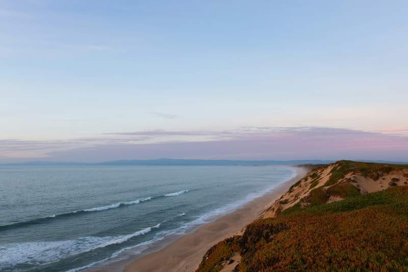 Stock photo of Monterey Bay at what looks like dusk.