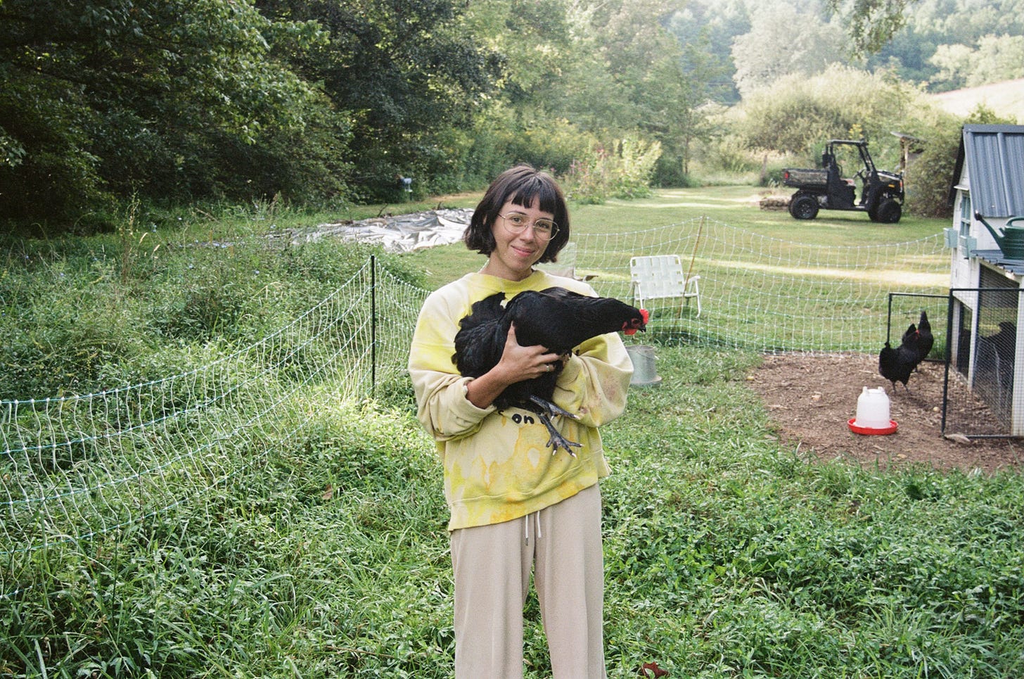 film photography, color film, portra 160, chickens, woman holding a chicken, homestead, farming, gardening film photography, color film, portra 160, chickens, woman holding a chicken, homestead, farming, gardening