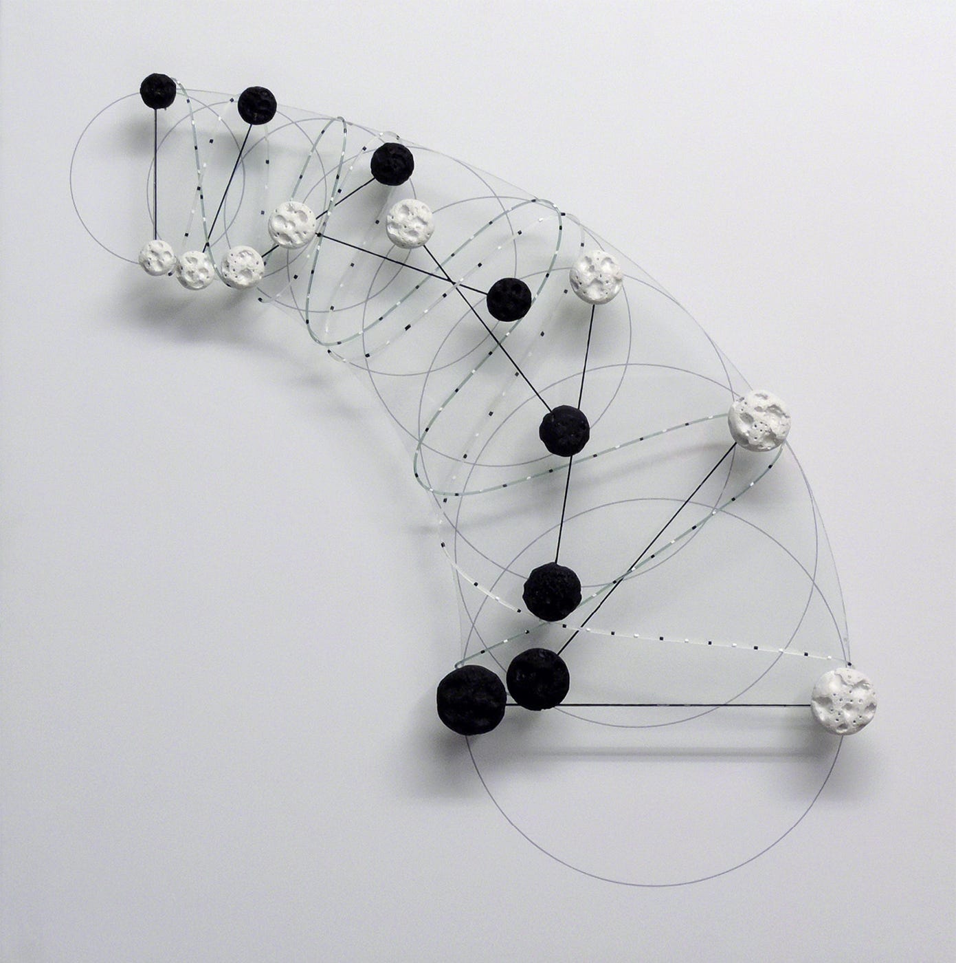 Haruhiko Sunagawa, Trajectory (spiral), (mixed media, stone (painted concrete), glass, nylon thread and acrylic on plywood), 2008 [Galerie Denise René, Paris. © Estate of Haruhiko Sunagawa]