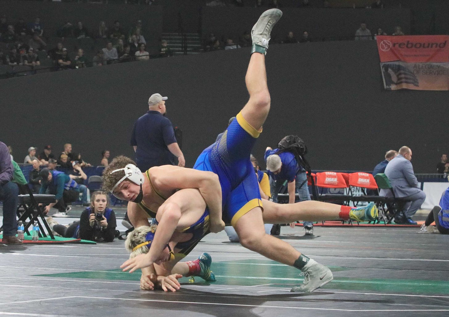Harrisburg's Brody Buzzard takes down Siuslaw's Jacob Mann during Friday's 3A boys wrestling finals at Memorial Coliseum. Harrisburg's Brody Buzzard takes down Siuslaw's Jacob Mann during Friday's 3A boys wrestling finals at Memorial Coliseum.