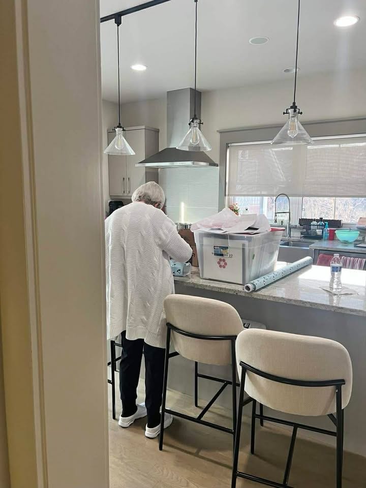 May be an image of kitchen island, range hood, lighting and indoors