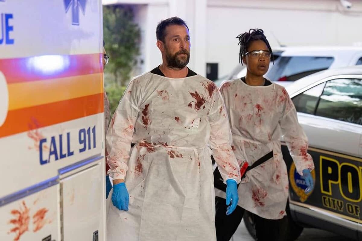 Dr. Robby and Dr. Ellis await victims in an improvised triage. 