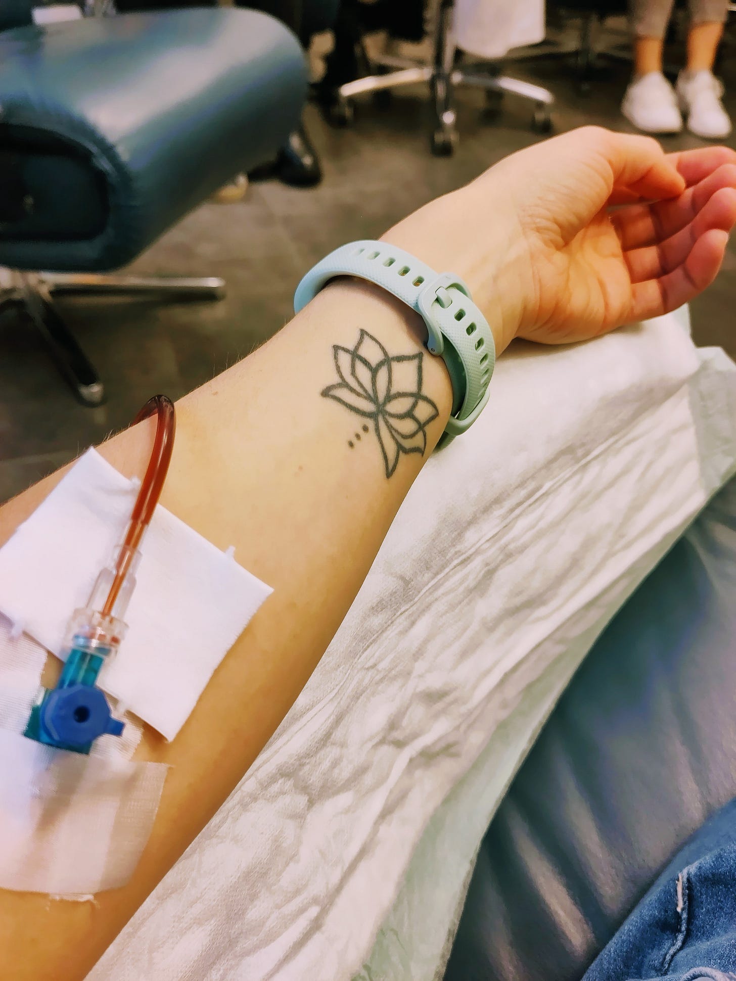 The photo shows the author's left arm as she gets a intravenous iron in an iron center.