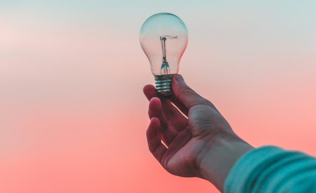 person holding light bulb