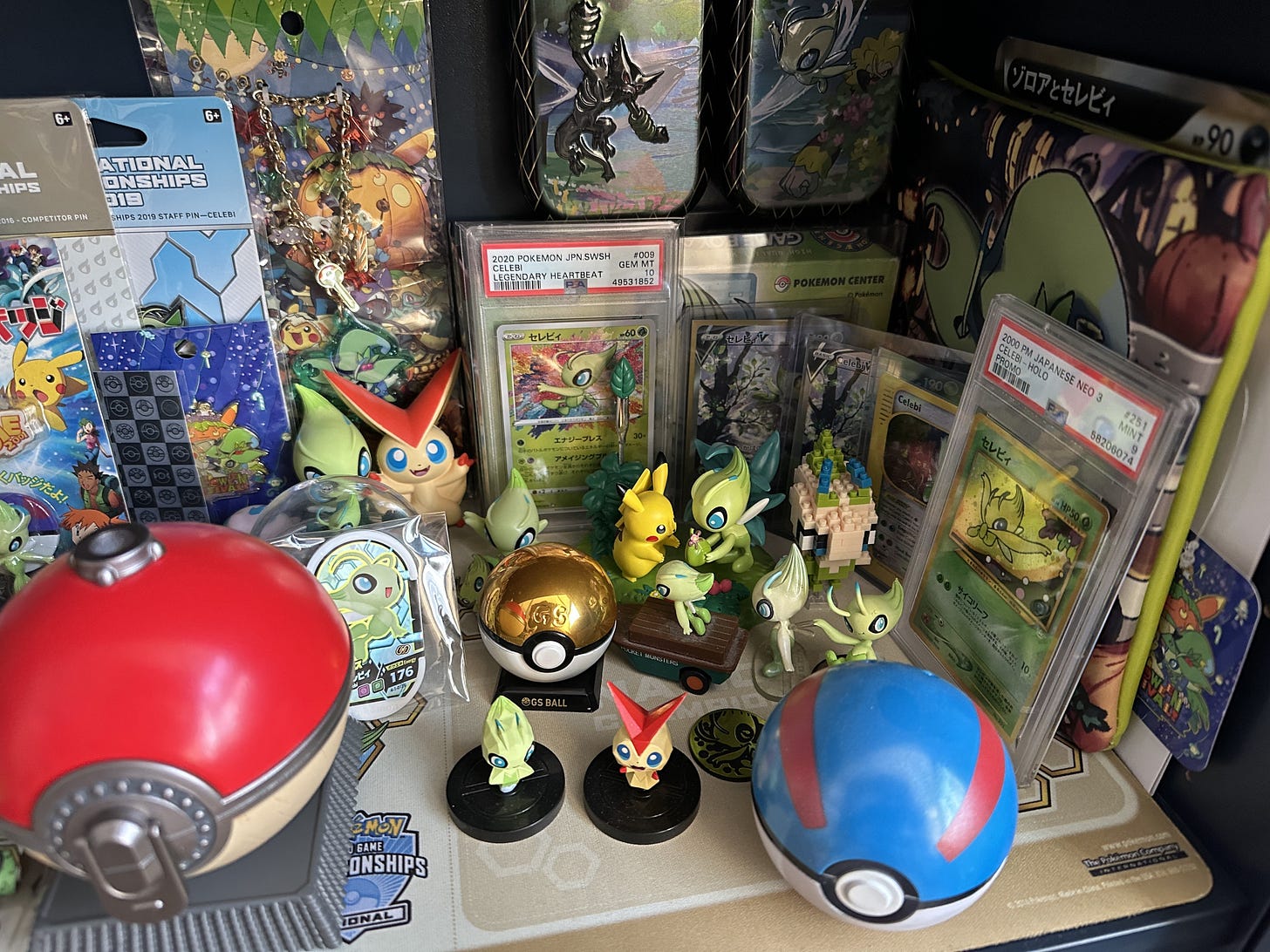More items from Joe's collection of items include cards, figures, and Poké Balls, including a special GS Ball More items from Joe's collection of items include cards, figures, and Poké Balls, including a special GS Ball