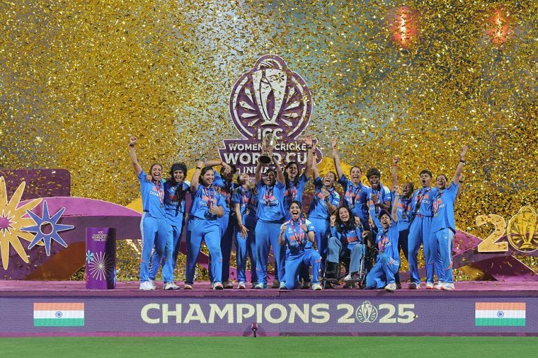 Harmanpreet Kaur of India lifts the ICC Women's Cricket World Cup trophy after her team's victory