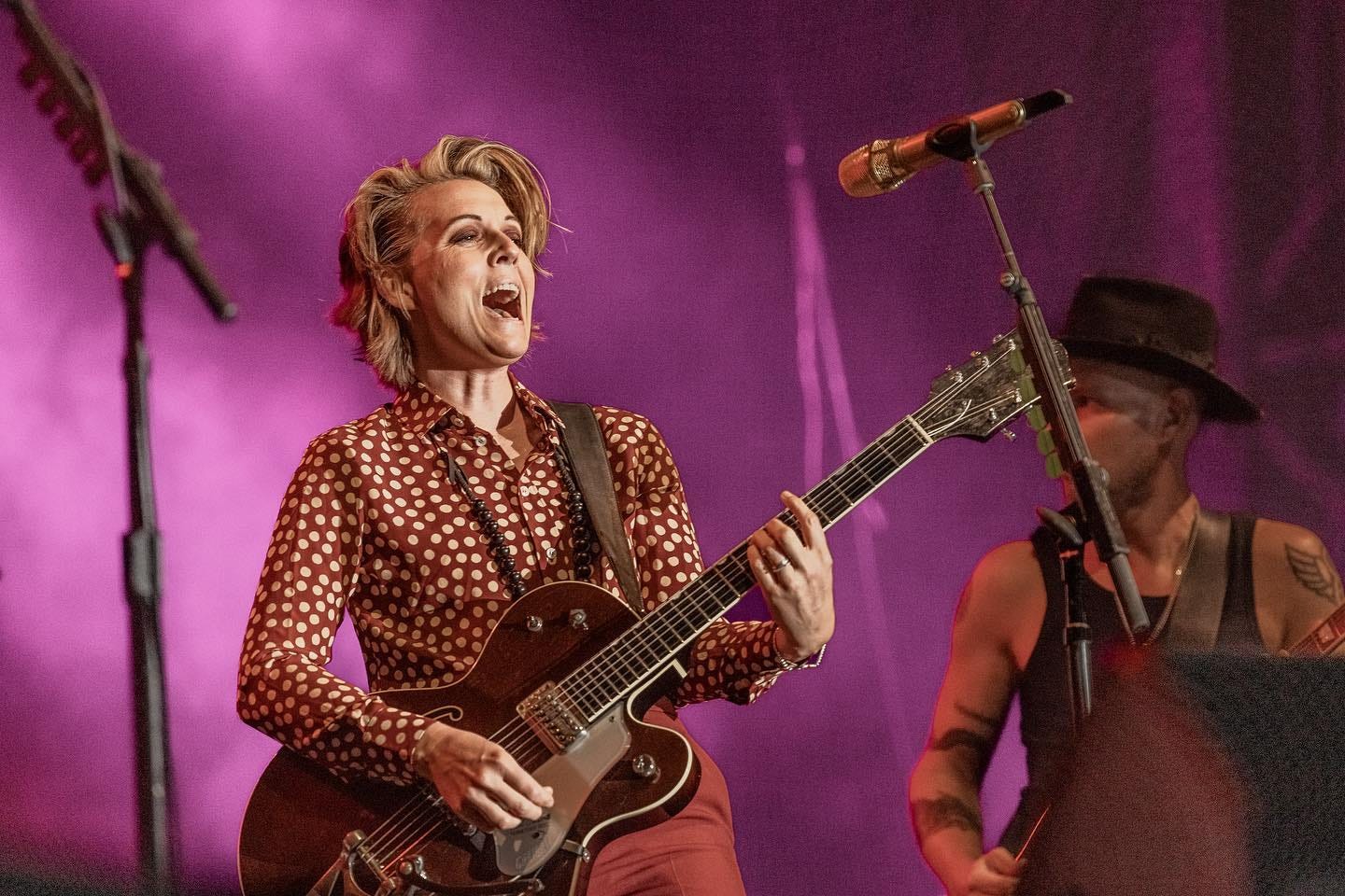 May be an image of 2 people, people standing, people playing musical instruments, guitar and indoor