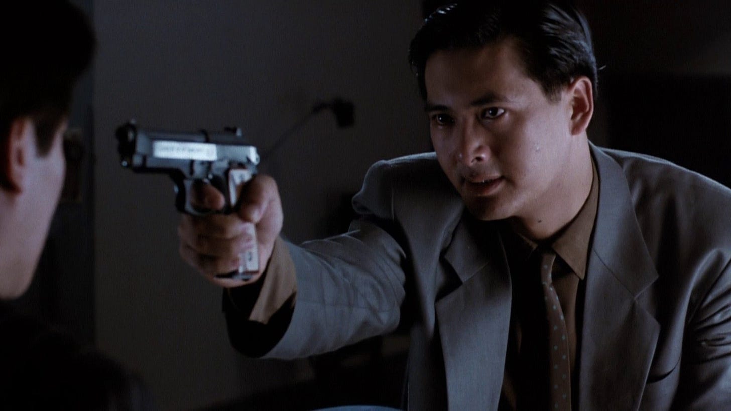 The Killer | Still features Chow Yun-fat as Ah Jong with a gun pointed out.