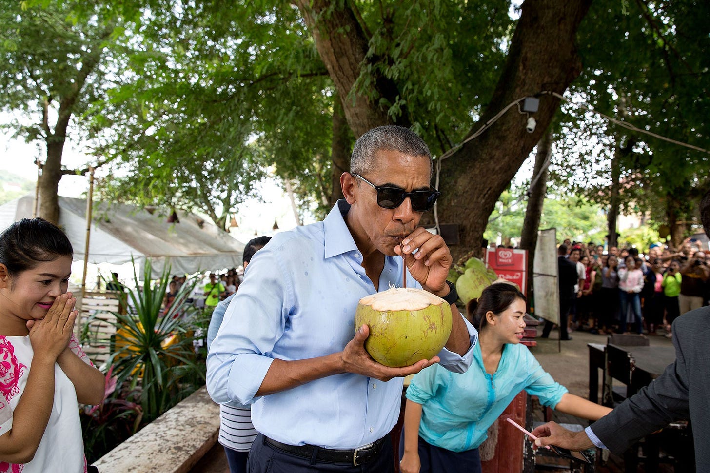 September 7, 2016: A refreshing moment in Luang Prabang, Laos, as President Obama sips from a freshly chopped coconut, a candid snapshot of his visit. September 7, 2016: A refreshing moment in Luang Prabang, Laos, as President Obama sips from a freshly chopped coconut, a candid snapshot of his visit.