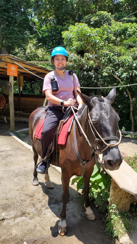 A tourist riding a horse in Costa Rica A tourist riding a horse in Costa Rica