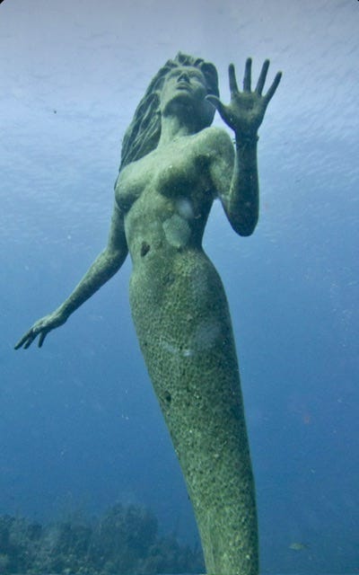 Amphitrite underwater statue off the coast of Grand Cayman Amphitrite underwater statue off the coast of Grand Cayman