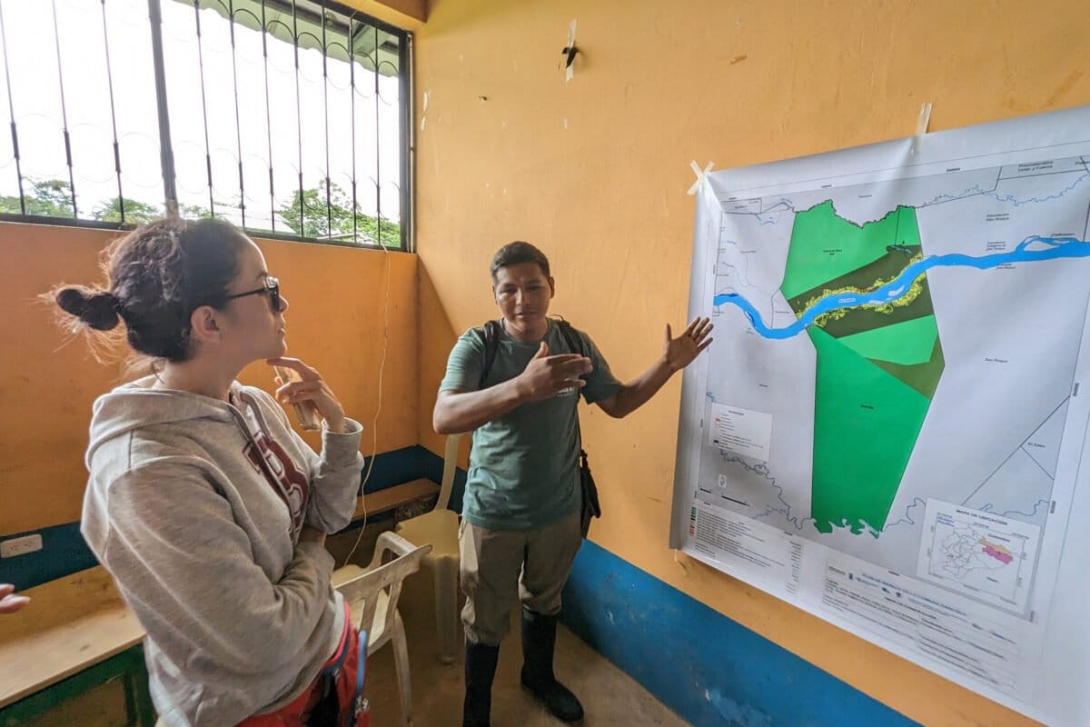Edwin, a leader from Sani Isla, showing a map of the community's territory in the Ecuadorian Amazon. Photo by Rhett Ayers Butler.