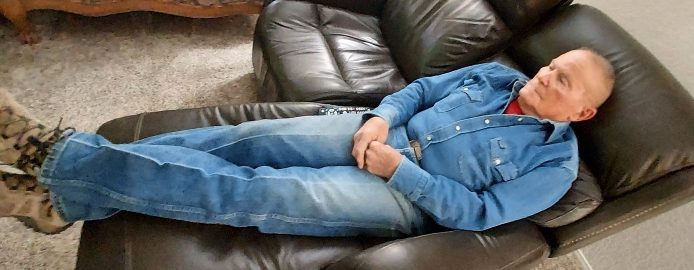 A person lying on a couch

Description automatically generated