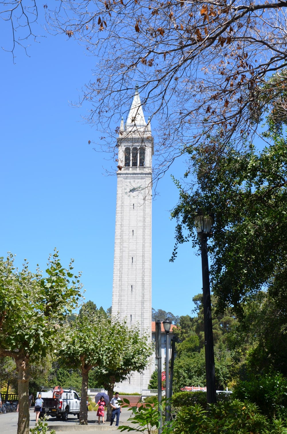 people near tower clock building during daytime people near tower clock building during daytime