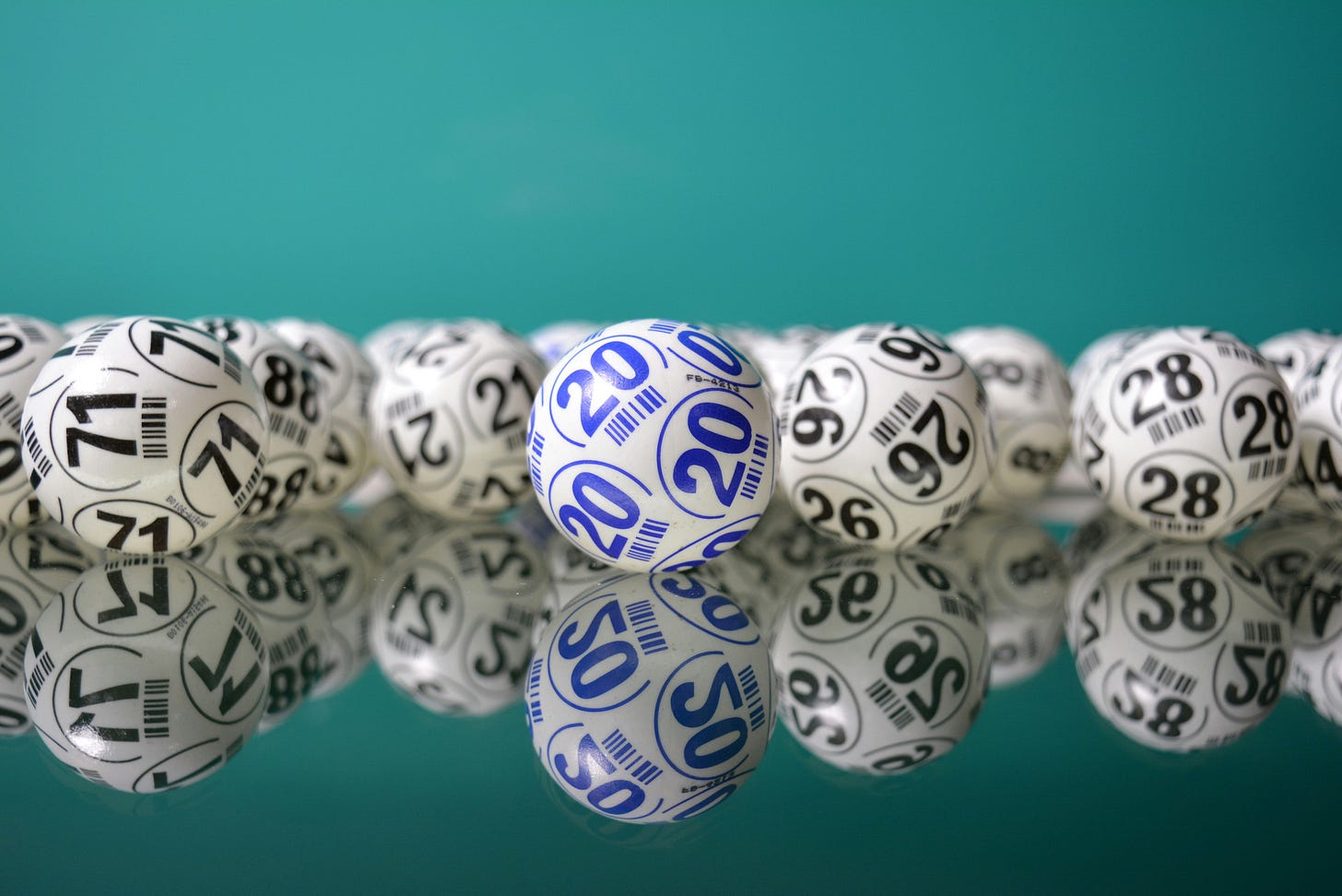 Color phot of a bunch of bingo balls with numbers on them