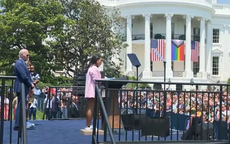 “In this White House, we believe …” President Joe Biden holding a Rainbow Demon Church tent revival on the White House lawn, as a Rainbow Demon Flag displaces the American Flag in the background. 
