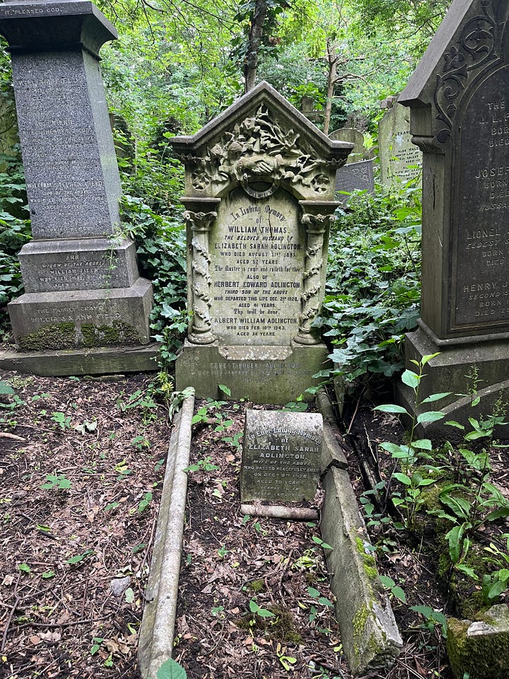 Six headstones with inscriptions of handshakes in a woodland cemetery