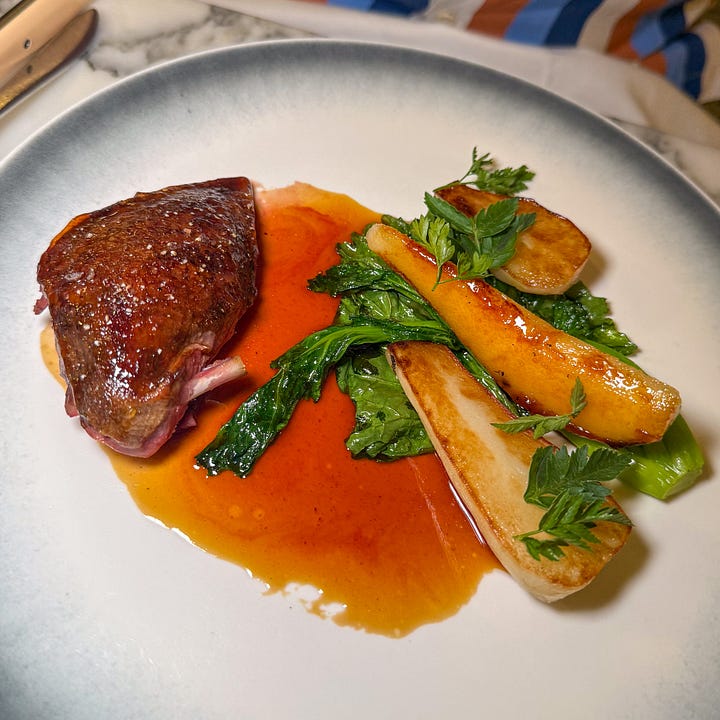acquered, crisp-skinned pigeon breast with seared turnip, greens, and glossy red jus at Semilla