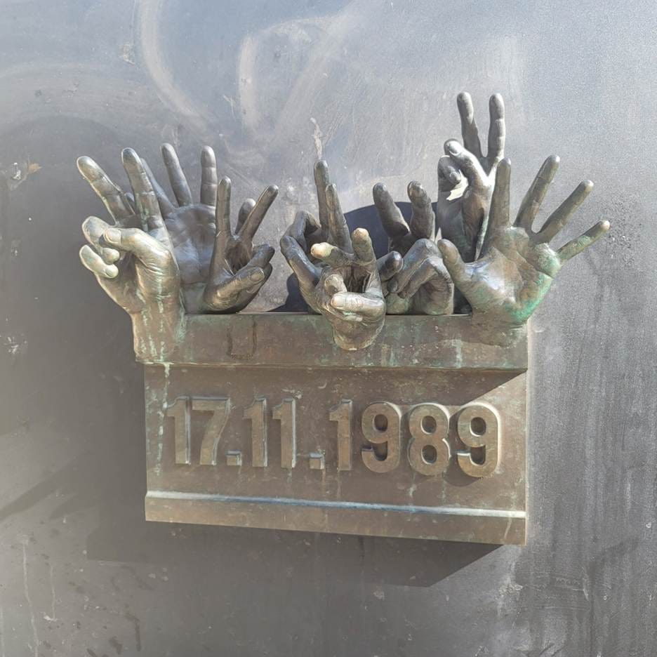 A sculpture of hands and numbers

AI-generated content may be incorrect.