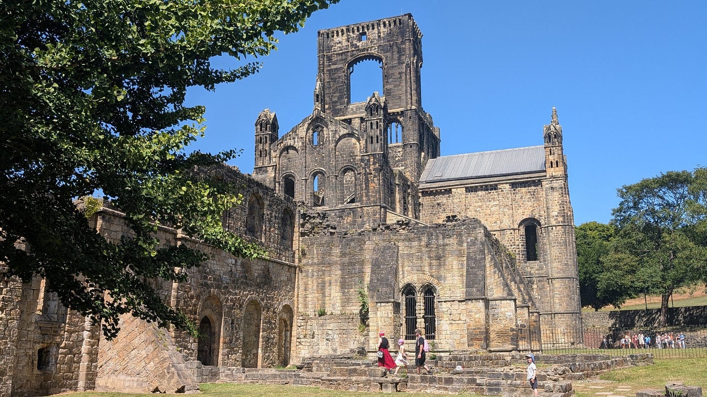 A view of the exterior of the main church, still standing a few storeys high.