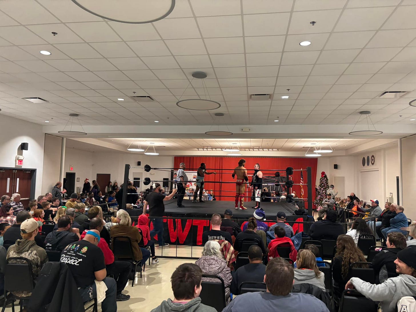 May be an image of 3 people and crowd