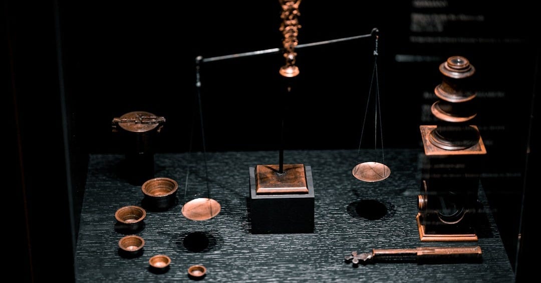 a display case with a scale, cups, and other items