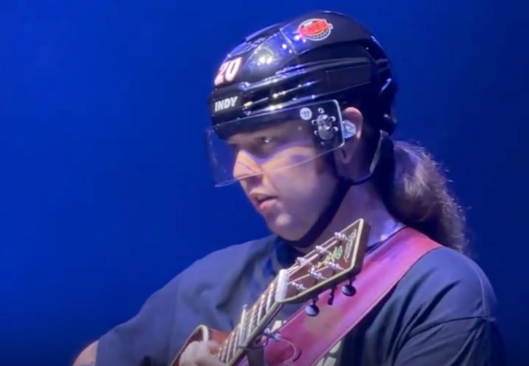 May be an image of hockey and guitar