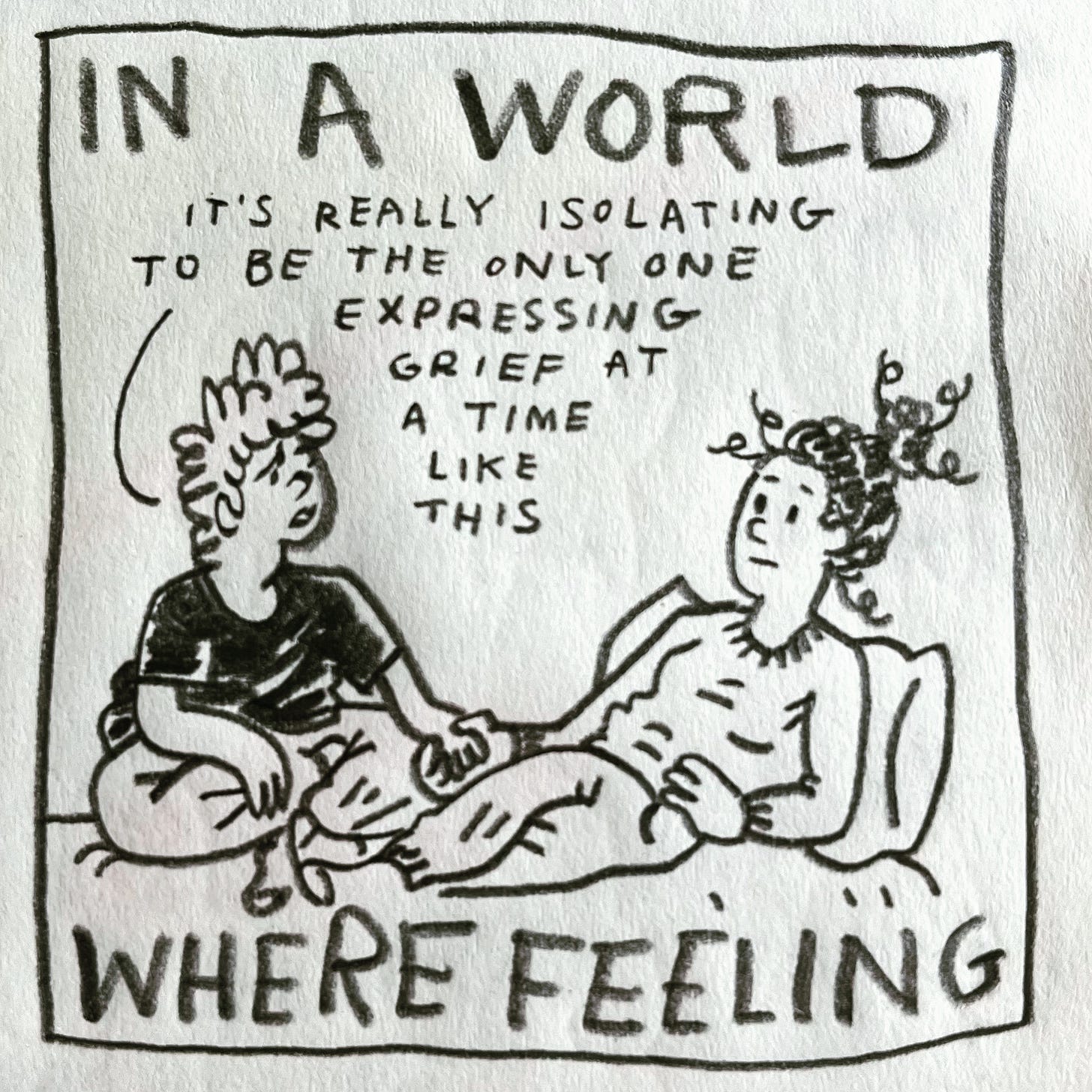 Panel 2: in a world where feeling Image: Lark sits cross-legged on a bed, holding hands with their sister, who is wearing a sweater, sweatpants and socks, leaning against a pillow against the wall. Lark is wearing a black T-shirt, sweatpants and socks. They frown, saying "it's really isolating to be the only one expressing grief at a time like this"