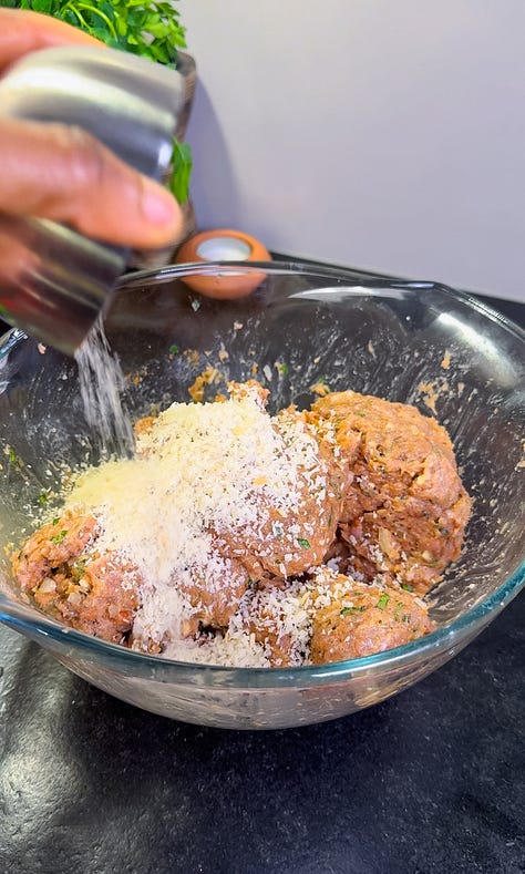 Photo 1: Overhead side shot of jerk chicken meatballs in a rich tomato sauce Photo 2: Tomato sauce cooking in a pan with teaspoonfuls of seasoning powder Photo 3: Two bowls of linguine pasta with the meatballs and tomato sauce with a small coating of grated parmesan cheese