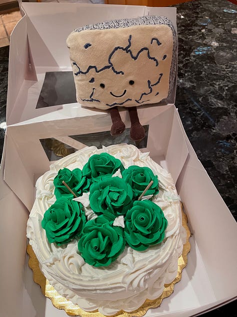 Photos of cakes, jewelry, flowers, Laura Lippman in a sweater dress, and a woman blowing out candles.